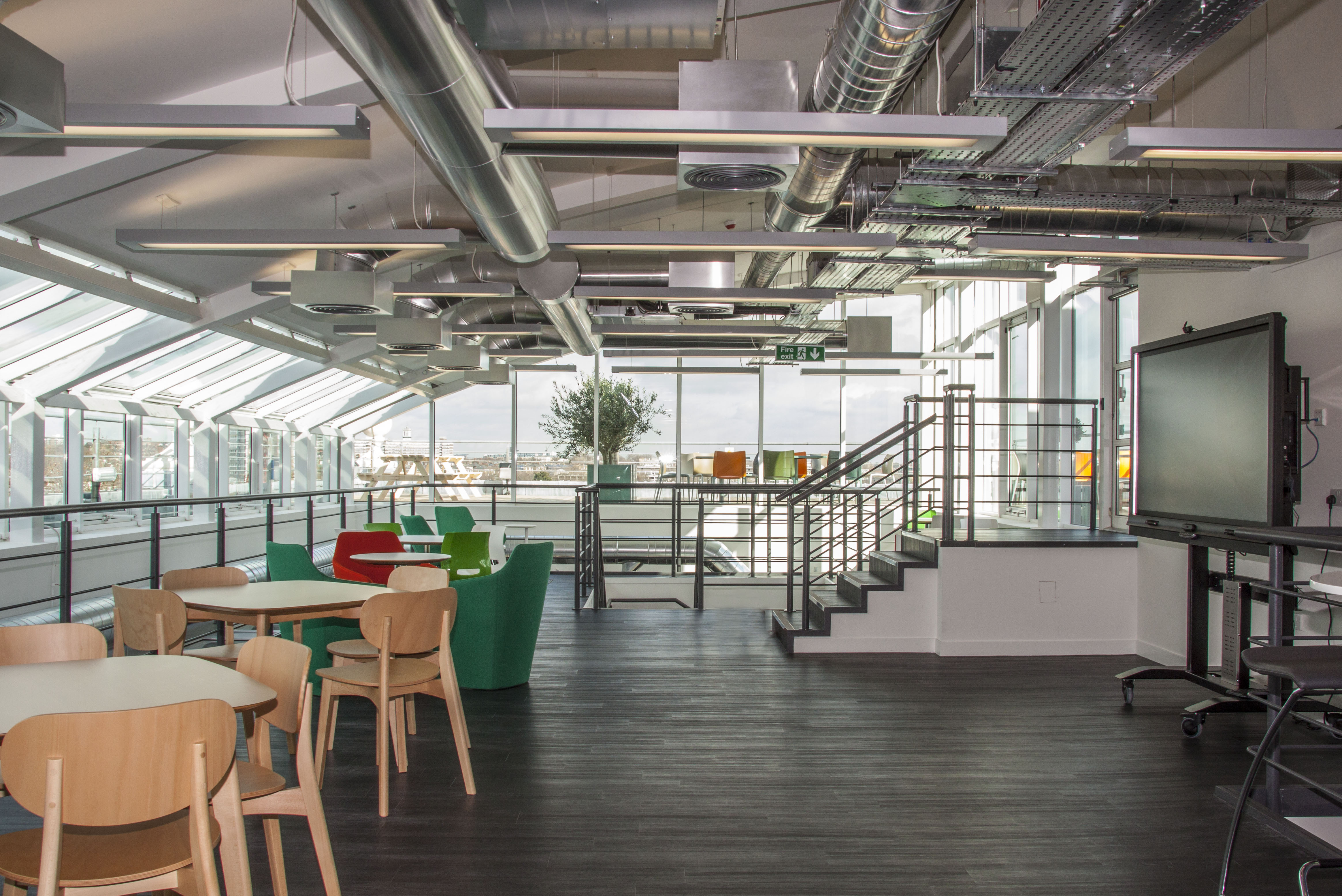 Bright office with lots of windows and stairwell