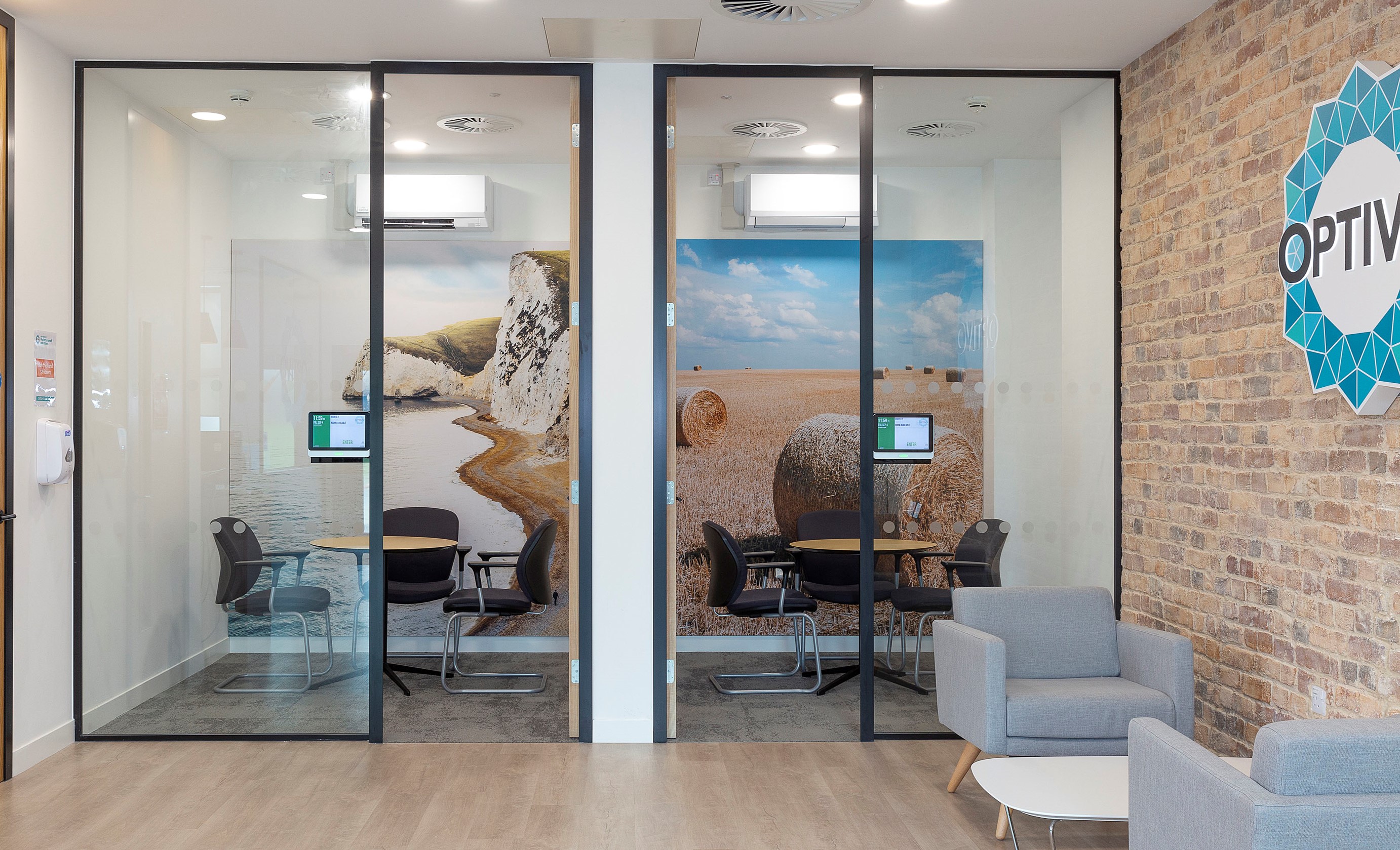 A glass doors with a picture of a beach and a chair