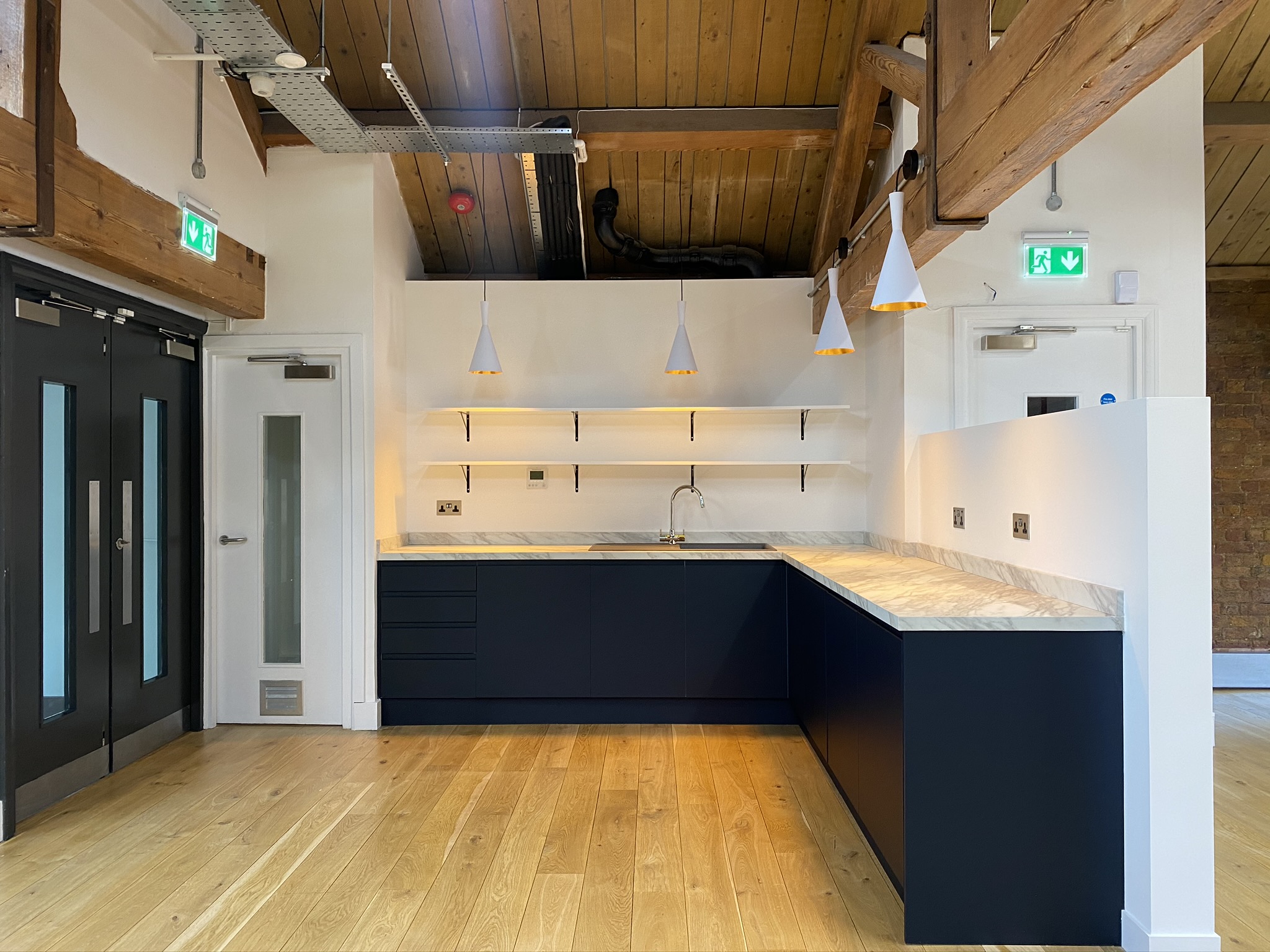Small office kitchen in dark blue