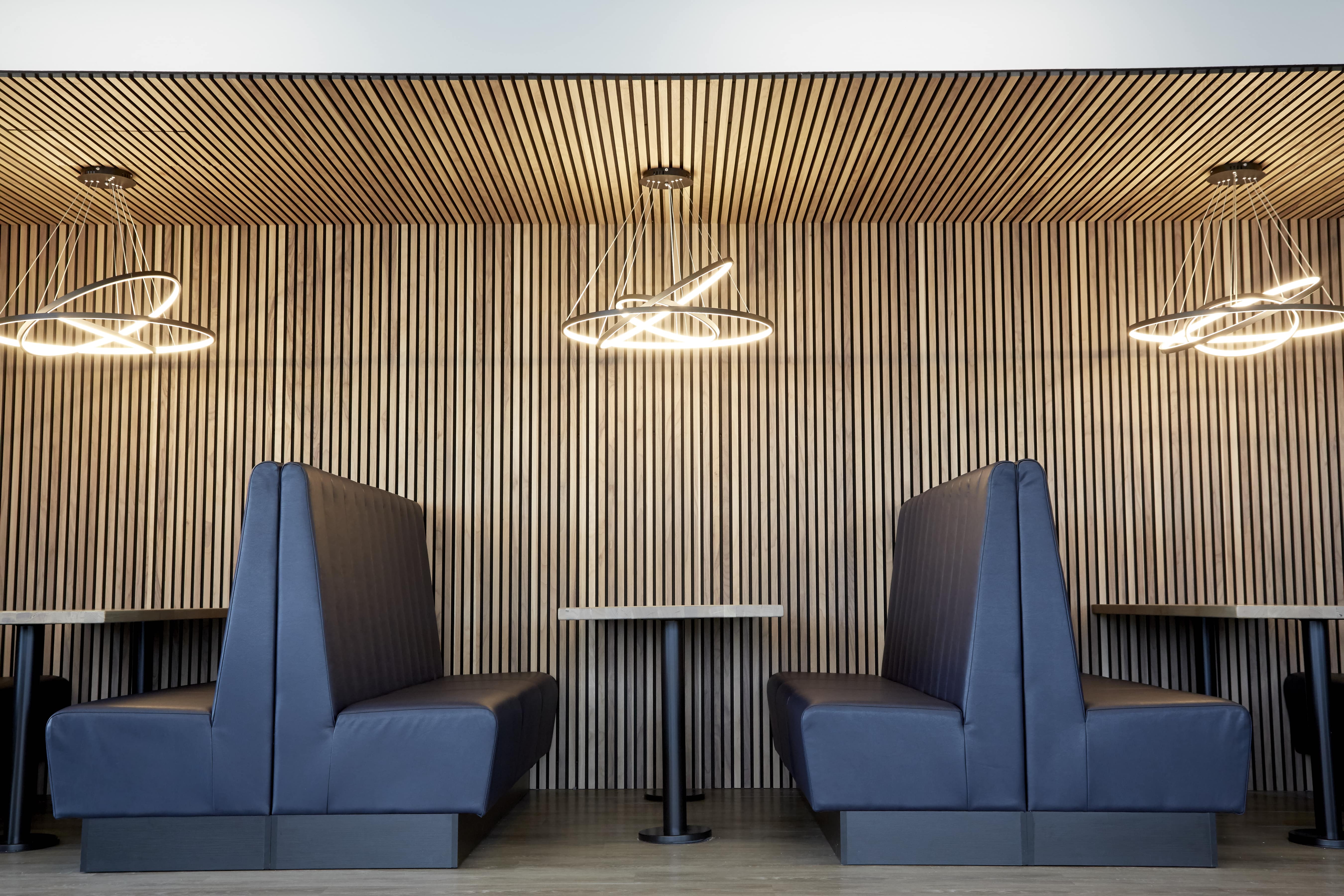 banner image of seating area with wooden panels